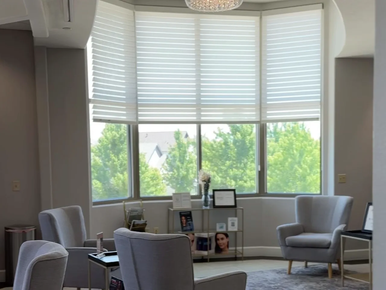 The Genesis Colorado Springs clinic lounge with grey seating and bright windows.